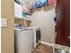 Functional laundry room featuring a washer, dryer, and ample storage space at 4030 Gold Mill Rdg, Canton, GA 30114