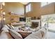 Spacious living room with a fireplace, large sectional sofa, and plenty of natural light at 4030 Gold Mill Rdg, Canton, GA 30114