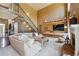 Inviting living room with wood accents, a cozy fireplace, and a large sectional sofa at 4030 Gold Mill Rdg, Canton, GA 30114