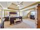 Spacious main bedroom featuring a tray ceiling, neutral carpet, and large windows for natural light at 4030 Gold Mill Rdg, Canton, GA 30114