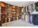 Expansive walk-in closet with custom shelving and hanging space for clothing and accessories at 4030 Gold Mill Rdg, Canton, GA 30114