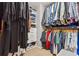 Organized walk-in closet with ample hanging space, built-in shelving, and drawer storage at 4030 Gold Mill Rdg, Canton, GA 30114