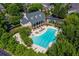 Aerial view of the pool area surrounded by lush greenery, next to the clubhouse at 4955 Ivy Ridge Se Dr # 404, Atlanta, GA 30339