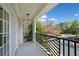 Private balcony with black metal railing overlooking mature trees at 4955 Ivy Ridge Se Dr # 404, Atlanta, GA 30339
