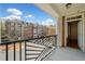 View from condo balcony showcases exterior, brick columns, and entrance at 4955 Ivy Ridge Se Dr # 404, Atlanta, GA 30339