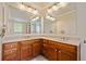 Bathroom with double sink vanity and decorative light fixtures at 4955 Ivy Ridge Se Dr # 404, Atlanta, GA 30339