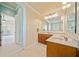 Bright bathroom with double doors and vanity with sink at 4955 Ivy Ridge Se Dr # 404, Atlanta, GA 30339