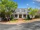 Community clubhouse boasts a manicured lawn, portico entry, and charming design at 4955 Ivy Ridge Se Dr # 404, Atlanta, GA 30339