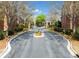 Elegant gated entrance to a private community with mature landscaping at 4955 Ivy Ridge Se Dr # 404, Atlanta, GA 30339