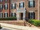 Charming brick condo with black shutters, white trim, and landscaped entrance stairs at 4955 Ivy Ridge Se Dr # 404, Atlanta, GA 30339