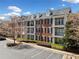 Three-story brick building with balconies and beautiful landscaping at 4955 Ivy Ridge Se Dr # 404, Atlanta, GA 30339