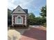 Charming guardhouse at the entrance of the gated community with red brick driveway at 4955 Ivy Ridge Se Dr # 404, Atlanta, GA 30339