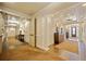 Inviting hallway with paneled walls, hardwood floors, and elegant lighting fixtures at 4955 Ivy Ridge Se Dr # 404, Atlanta, GA 30339