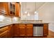This kitchen features stainless steel appliances and dark wood cabinets at 4955 Ivy Ridge Se Dr # 404, Atlanta, GA 30339