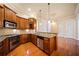 Modern kitchen with stainless appliances, hardwood floors, granite counters, and pendant lights at 4955 Ivy Ridge Se Dr # 404, Atlanta, GA 30339