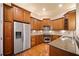 Well-equipped kitchen featuring stainless steel appliances and wooden cabinetry at 4955 Ivy Ridge Se Dr # 404, Atlanta, GA 30339