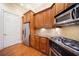 The kitchen features stainless steel appliances, granite countertops, and wood cabinets at 4955 Ivy Ridge Se Dr # 404, Atlanta, GA 30339