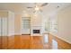 Sunlit living room with a fireplace, built-in shelving, and door to the outside at 4955 Ivy Ridge Se Dr # 404, Atlanta, GA 30339