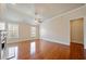 Spacious living room with fireplace, hardwood floors, and large windows at 4955 Ivy Ridge Se Dr # 404, Atlanta, GA 30339