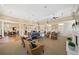 Spacious community living room with ample seating, natural light, and fireplace at 4955 Ivy Ridge Se Dr # 404, Atlanta, GA 30339