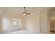 The primary bedroom has built in shelving and doors to the outside at 4955 Ivy Ridge Se Dr # 404, Atlanta, GA 30339