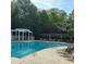 Relaxing community pool with lounge chairs and covered seating, perfect for enjoying sunny days at 4955 Ivy Ridge Se Dr # 404, Atlanta, GA 30339