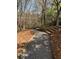 Gravel walking path with timber stairs through the community, surrounded by nature at 4955 Ivy Ridge Se Dr # 404, Atlanta, GA 30339