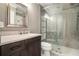 Bathroom with tiled shower and granite sink at 708 Mcgill Ne Pl, Atlanta, GA 30312