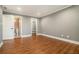 Bedroom with hardwood floors, offering access to bathroom and walk-in closet at 708 Mcgill Ne Pl, Atlanta, GA 30312