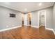 Spacious bedroom featuring hardwood floors and neutral paint, with bathroom and closet access at 708 Mcgill Ne Pl, Atlanta, GA 30312