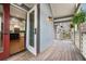 Open doorway leads to a kitchen with a large island with seating and stainless steel appliances at 708 Mcgill Ne Pl, Atlanta, GA 30312
