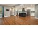 Modern kitchen featuring a center island, stainless steel appliances, and dark wood floors at 708 Mcgill Ne Pl, Atlanta, GA 30312