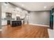 Bright kitchen open to living space, featuring stainless appliances and a center island with seating at 708 Mcgill Ne Pl, Atlanta, GA 30312