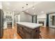 Kitchen island with storage and quartz countertop overlooks the living room with a fireplace at 708 Mcgill Ne Pl, Atlanta, GA 30312