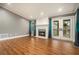 Cozy living room with hardwood floors, fireplace, mantle, and access to a balcony at 708 Mcgill Ne Pl, Atlanta, GA 30312