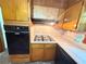 Well-equipped kitchen featuring black appliances and ample wood cabinetry at 2414 West Rd, Riverdale, GA 30296