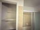 Bathroom with tiled shower/tub and open shelving at 2414 West Rd, Riverdale, GA 30296