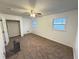Bedroom featuring neutral carpet, natural light, and a closet at 2414 West Rd, Riverdale, GA 30296