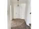 Inviting entryway with a classic white front door and stylish overhead lighting at 2414 West Rd, Riverdale, GA 30296