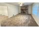 Living room with stone fireplace and large windows at 2414 West Rd, Riverdale, GA 30296
