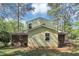 Exterior view of the home's backyard, showcasing the siding and a lush lawn at 3052 Sw Highbury Sw Trl, Atlanta, GA 30354