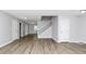 Spacious living room with wood-look floors, fresh paint, natural light, and staircase to the second floor at 3052 Sw Highbury Sw Trl, Atlanta, GA 30354
