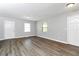 Open-concept living room featuring modern flooring and lots of natural light at 3052 Sw Highbury Sw Trl, Atlanta, GA 30354