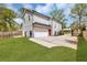 This home features a fenced-in yard, a two-car garage, and a lengthy driveway on a grassy lot at 3117 Dogwood Dr, Hapeville, GA 30354