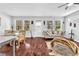 Bright, open living area adjacent to a modern dining area with dark hardwood floors at 3117 Dogwood Dr, Hapeville, GA 30354
