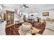 Open concept living area boasts hardwood floors, fireplace, eat-in kitchen with island and stainless appliances at 3117 Dogwood Dr, Hapeville, GA 30354