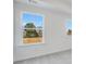 Carpeted bedroom with natural light and large windows with a view at 93 Wilder Ridge Way, Lawrenceville, GA 30044