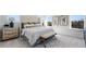 A brightly lit main bedroom features a queen-size bed and two windows with forested views at 93 Wilder Ridge Way, Lawrenceville, GA 30044
