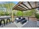 Comfortable covered back deck with modern seating and stylish outdoor furniture, ideal for relaxing at 1251 Pierce Se Ave, Smyrna, GA 30080