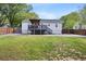 Expansive backyard view showcasing a deck, patio area, and a well-maintained lawn at 1251 Pierce Se Ave, Smyrna, GA 30080